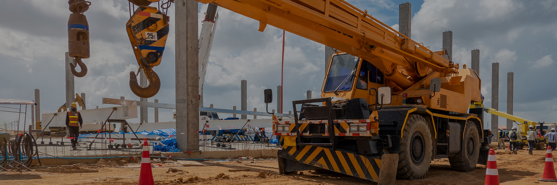 Mobile Crane on a road and tower crane in construction site